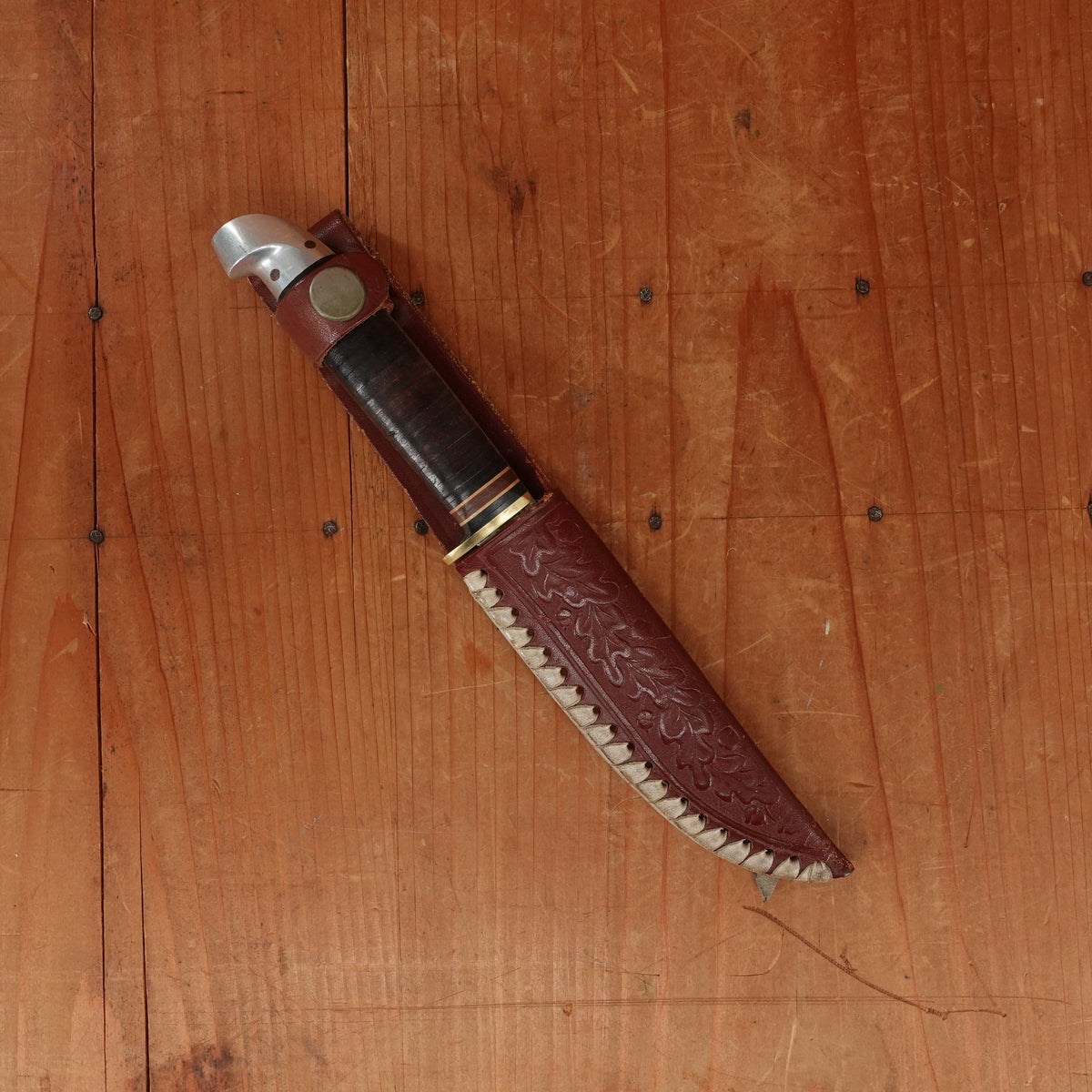 Western 4" Bird & Trout L4ABG Carbon Steel Stacked Leather 1950s