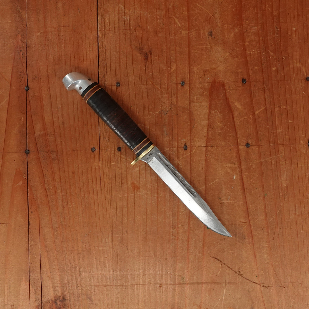 Western 4" Bird & Trout L4ABG Carbon Steel Stacked Leather 1950s