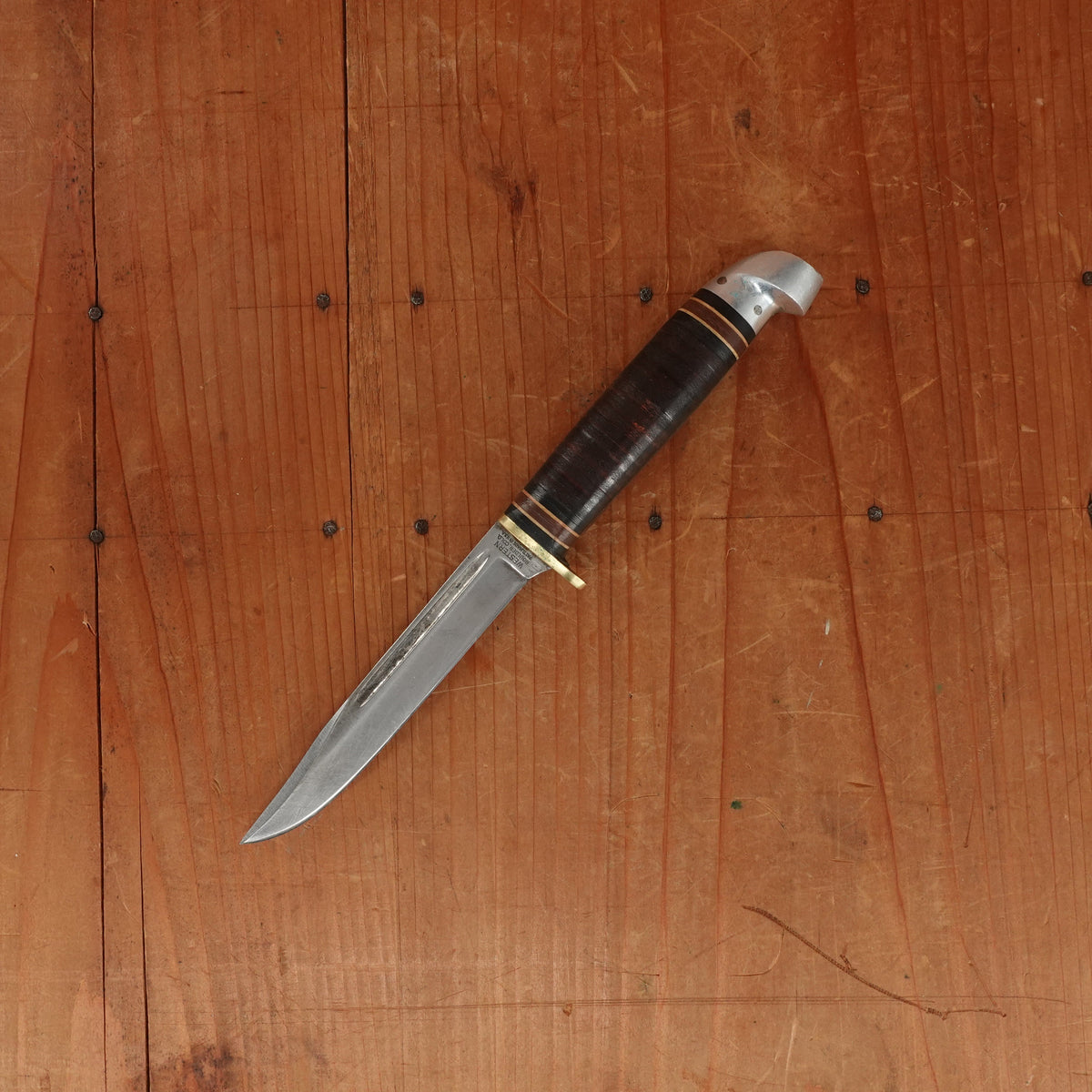 Western 4" Bird & Trout L4ABG Carbon Steel Stacked Leather 1950s