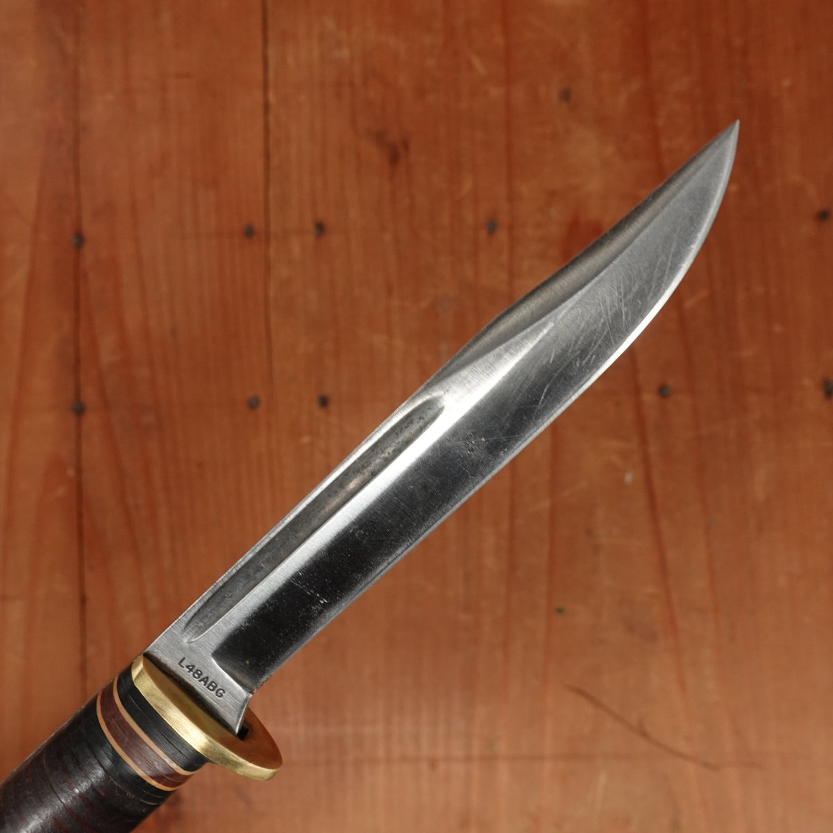 Western 4" Bird & Trout L4ABG Carbon Steel Stacked Leather 1950s