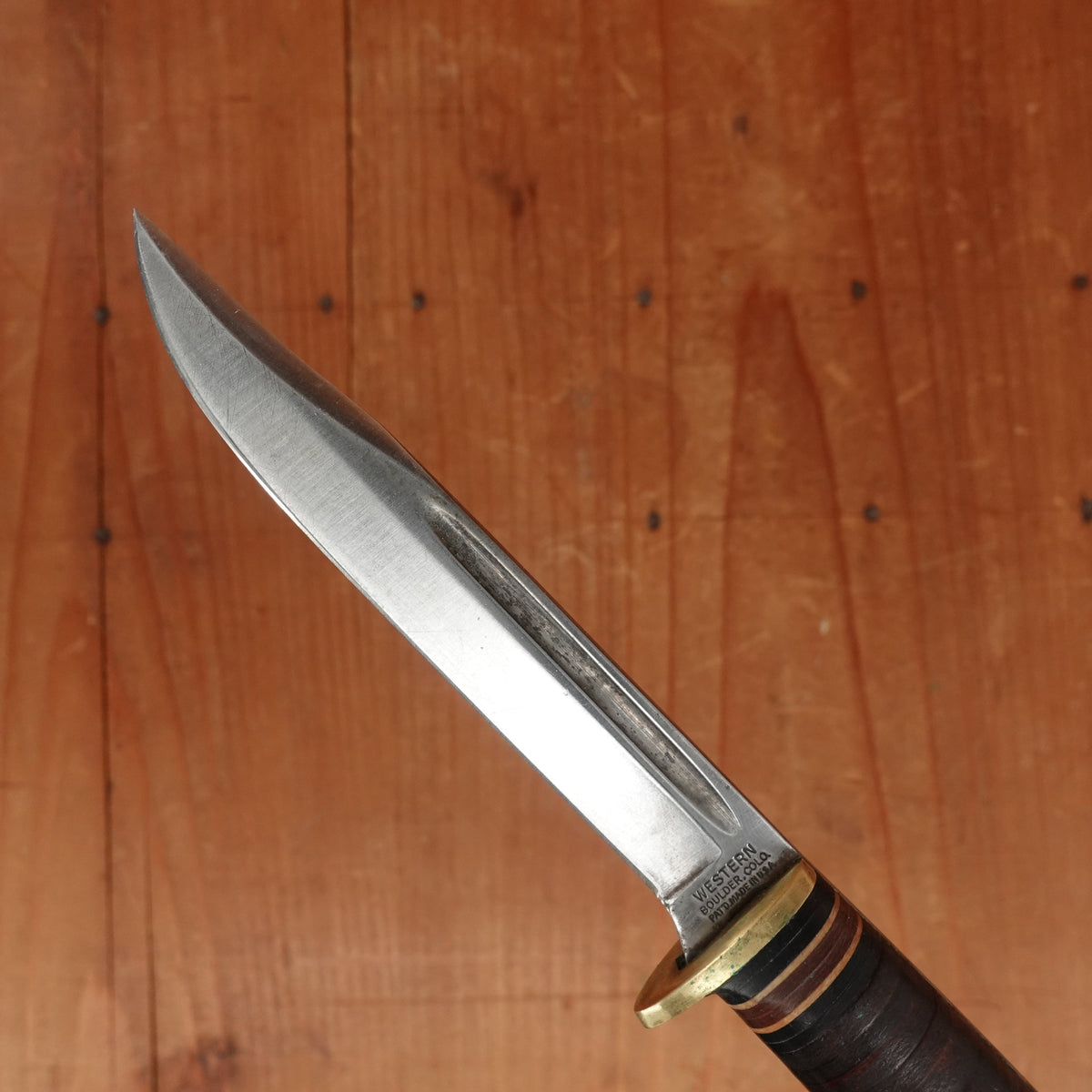 Western 4" Bird & Trout L4ABG Carbon Steel Stacked Leather 1950s