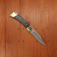 Buck 110 Folding Hunter 3 3/4” Clip Point 420HC Lockback Ebony Handle with Leather Sheath