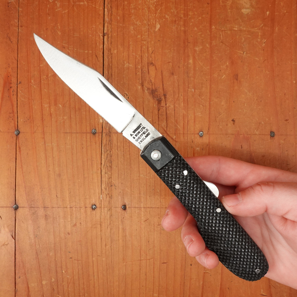 A Wright & Son Sheffield WW2 Issue Pattern 4 5/8" Clip Point Carbon Lockback Black Composite Handle