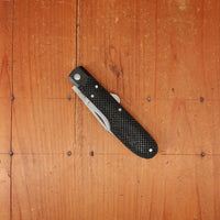 A Wright & Son Sheffield WW2 Issue Pattern 4 5/8" Clip Point Carbon Lockback Black Composite Handle