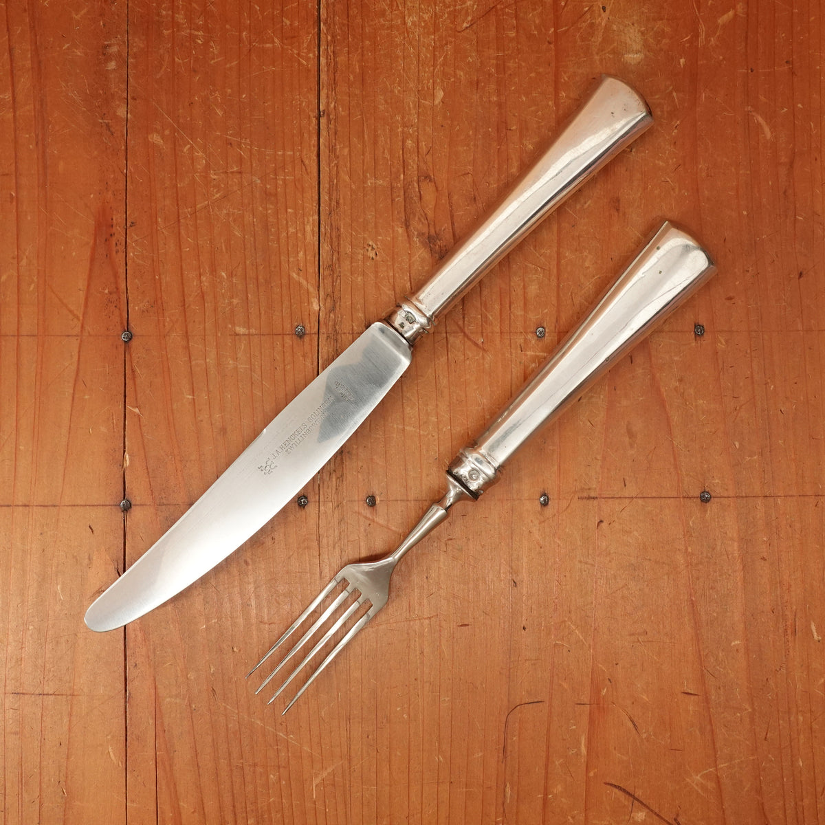 J.A. Henckels Dinner Knife and Fork Pair (One Pair 2pc) Stainless Blade Nickel Plated Carbon Fork Coin Silver Solingen 1920s